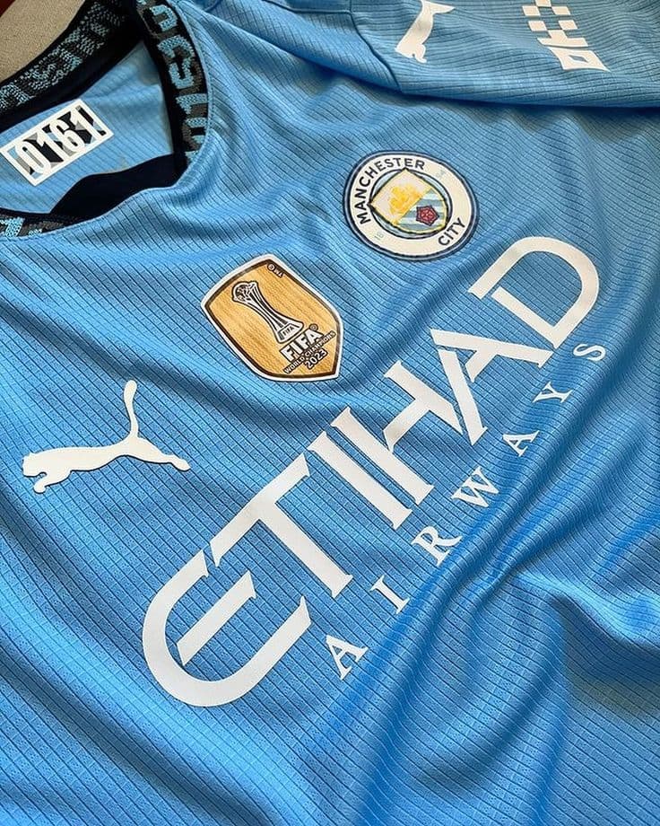This is a Manchester City football jersey. - image 1